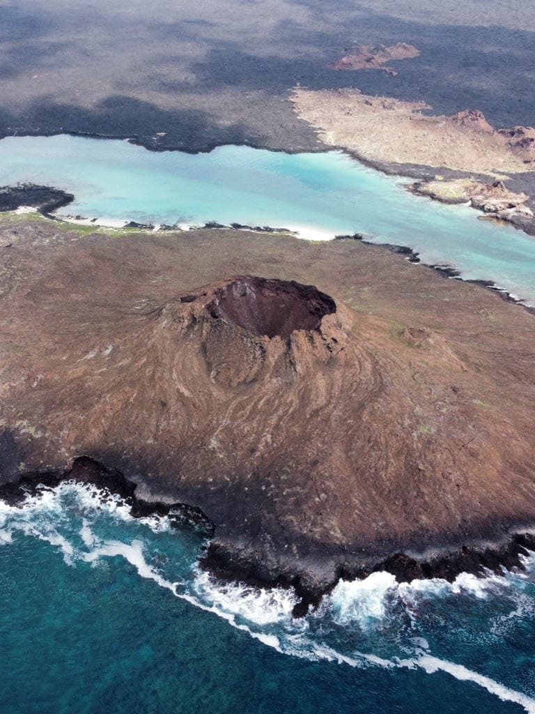 Aerial view of volcanic island landscape - chinese hat - Galapagos Islands in a Glimpse - Golden Galapagos Cruises