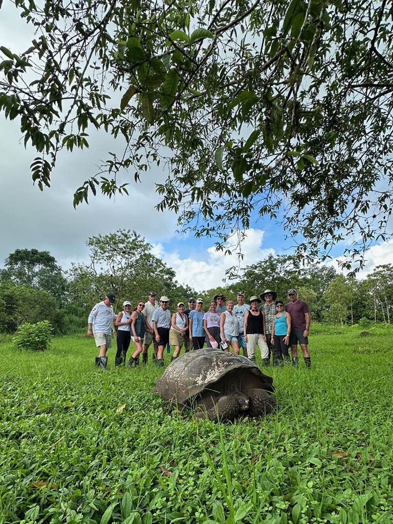 Group of people with giant tortoise - black turtle cove - santa cruz island - Galapagos Islands in a Glimpse - Golden Galapagos Cruises
