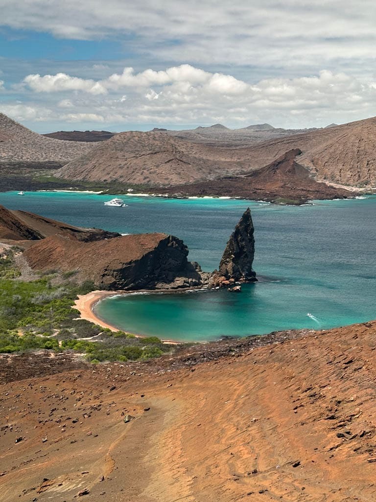 Rocky coastline with turquoise waters - Galapagos Islands in a Glimpse - Bartholomew Island - Golden Galapagos Cruises